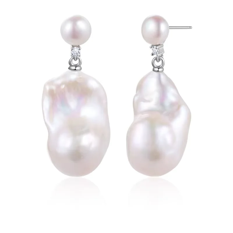 White baroque pearl drop earrings with small pearl studs.