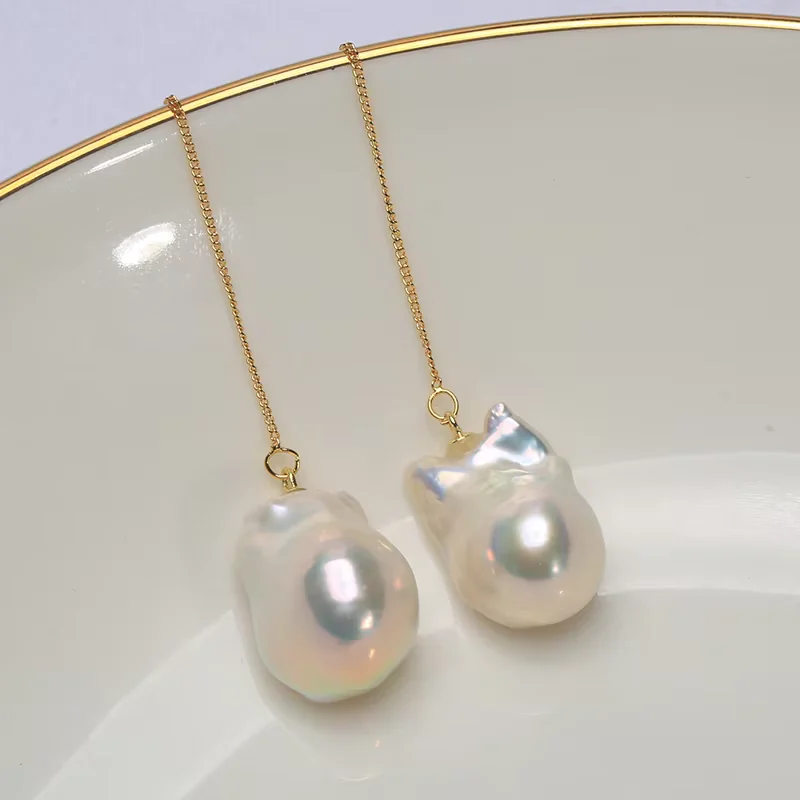 Fine chain threader earrings with white baroque pearls.