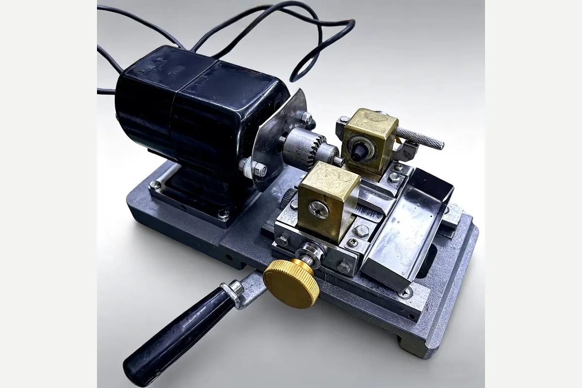 A compact bench mounted pearl drilling machine